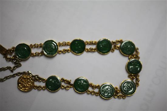 A Chinese high carat double chain link gold and jadeite bracelet, 6.5in.